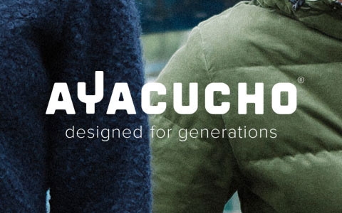 Two people's torsos outside, wearing Ayacucho gear.