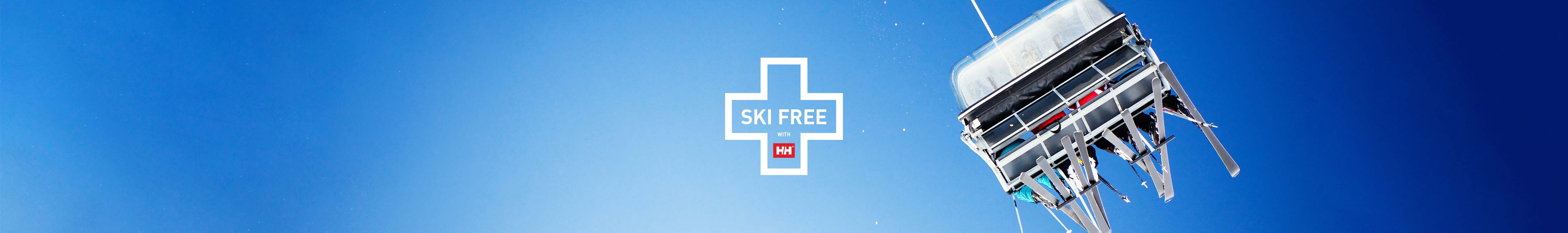 SKI FREE Helly Hansen offer logo on the blue sky background with the ski lift on the right.
