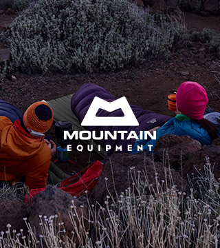 Two people wearing and equipped with the Mountain Equipment gear relaxing outdoors
