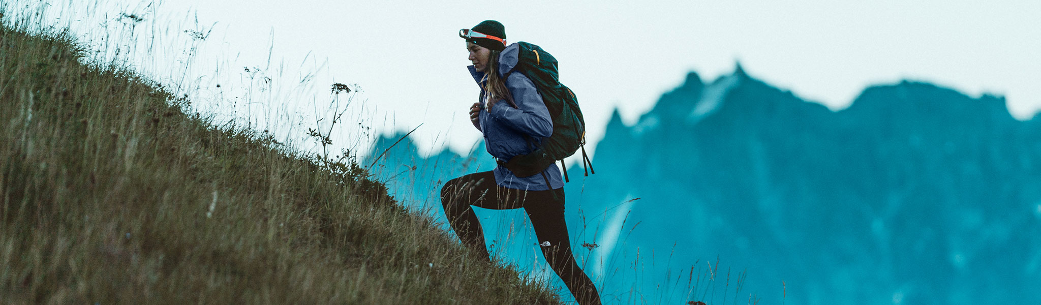 A woman hiking in a North Face Futurelight Jacket 