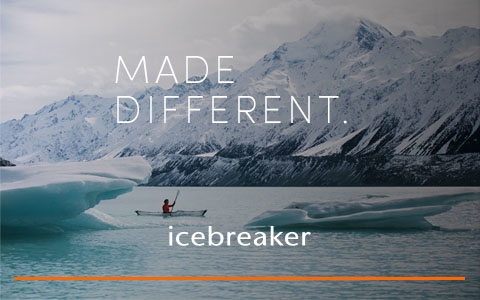 Woman in a lake wearing Icebreaker gear