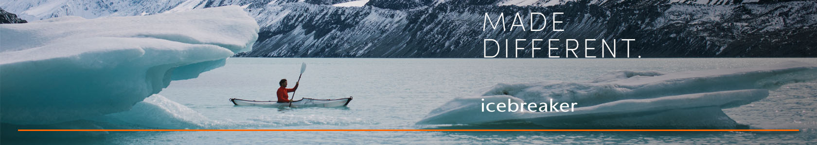 Woman in a lake wearing Icebreaker gear