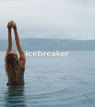 Woman in a lake wearing Icebreaker gear