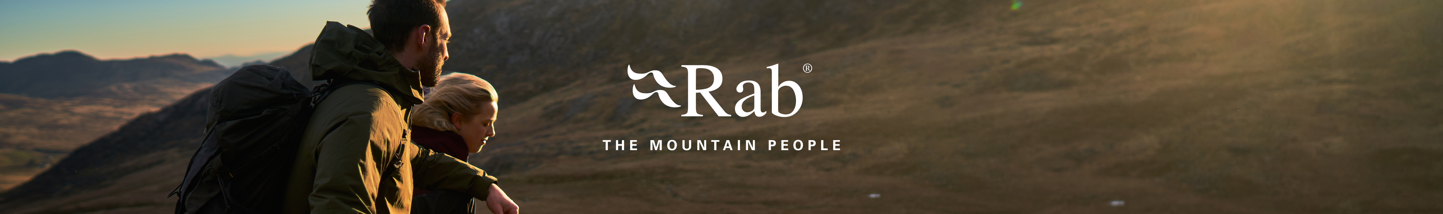 People wearing and using Rab gear are hanging on a snow mountain and enjoying interesting snow views and a drink.