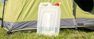bottle of water against a tent