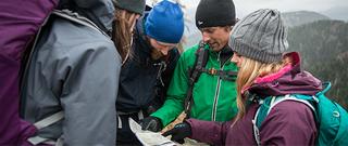 Group looking down at map