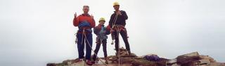 Young Leo Holding at Old Man of Hoy with father and family friend