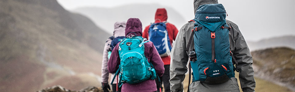 A group of people on a hike wearing rucksacks 