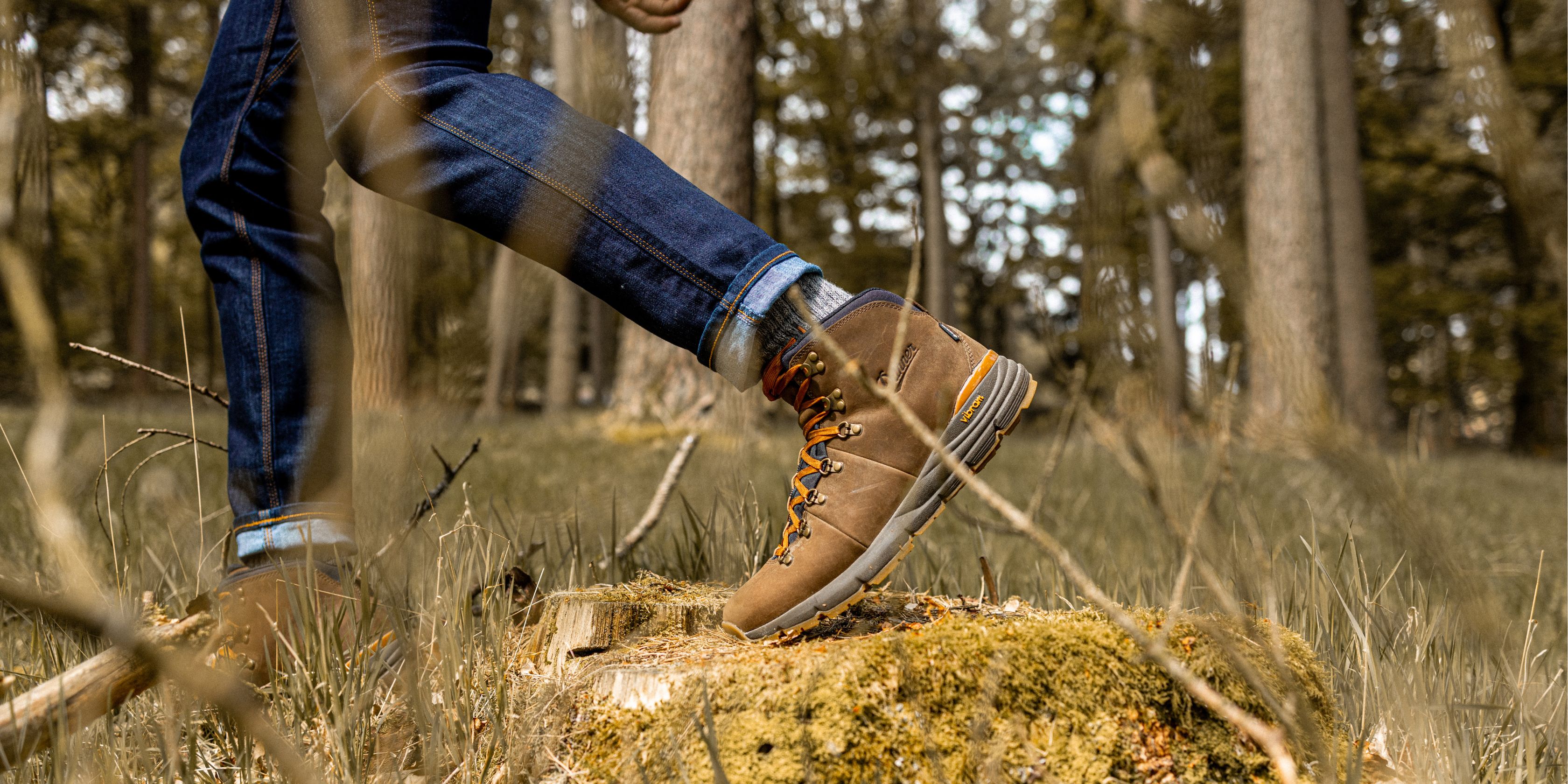A zoomed in photo of a man's legs wearing waterproof walking boots