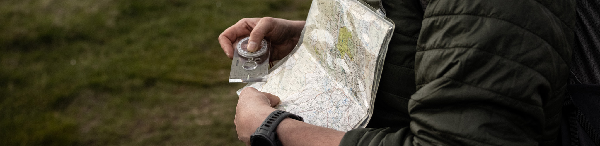 A person holding navigation tools