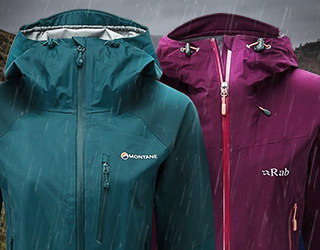 Group walking down mountain in waterproofs