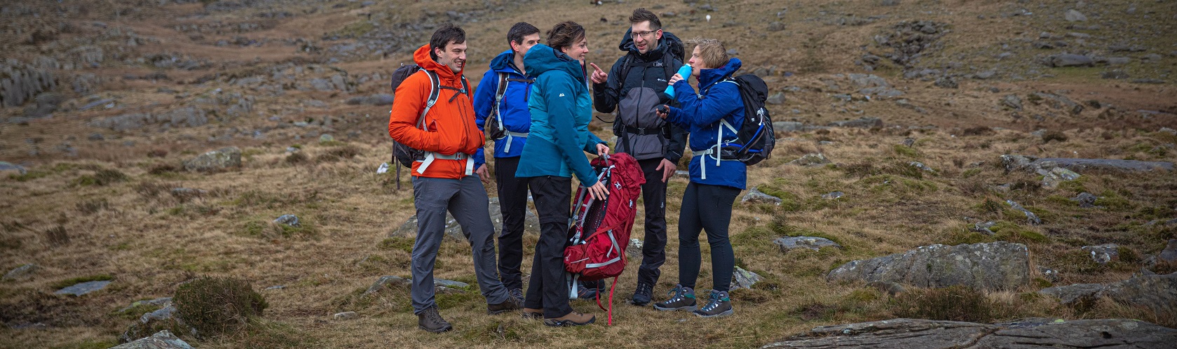 Row of Coloured Waterproofs Including Rab and Berghaus 