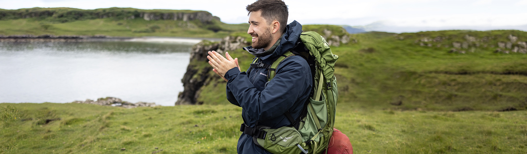 A man on a hike wearing a waterproof jacket 
