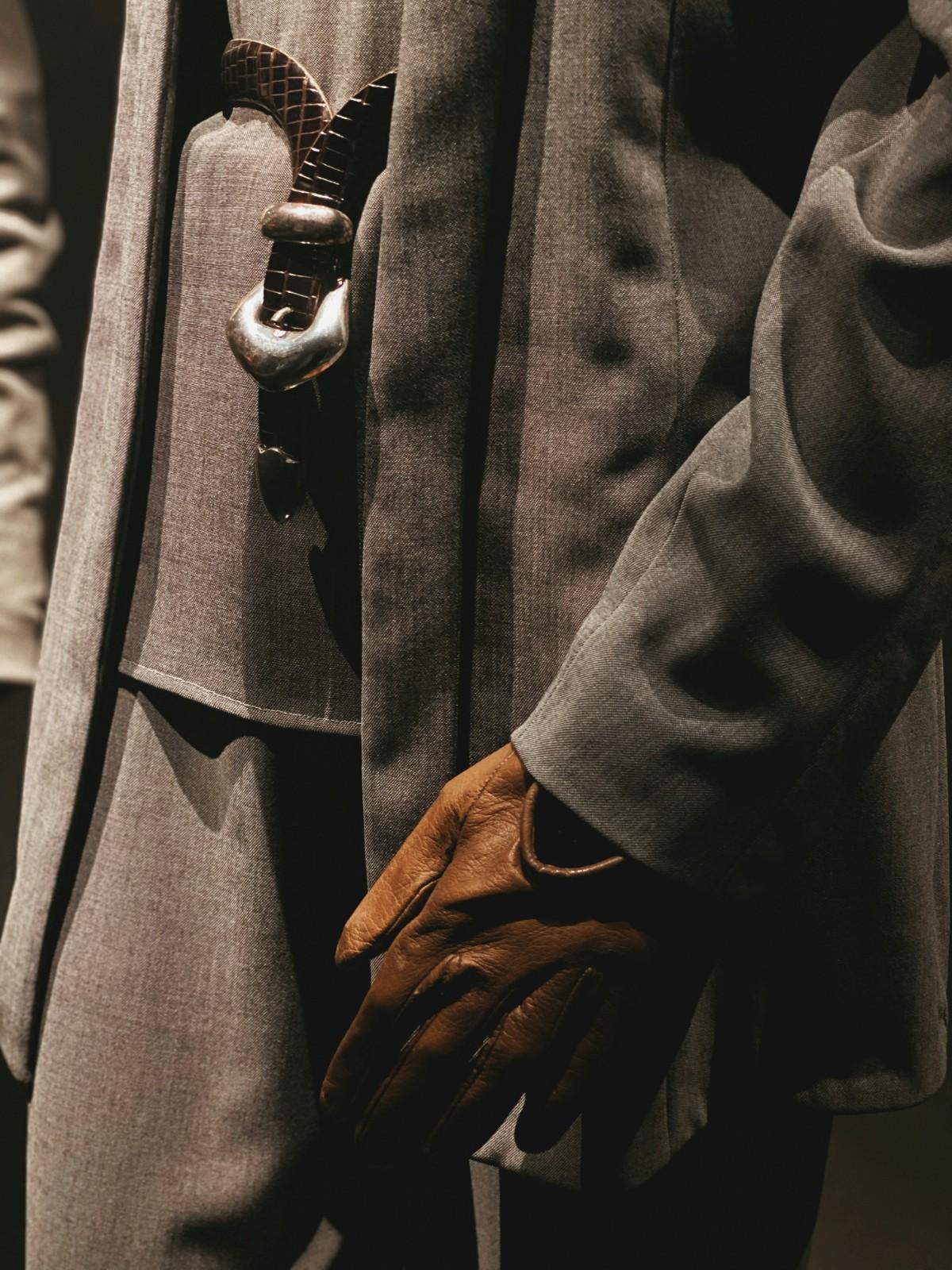 A person wearing leather gloves