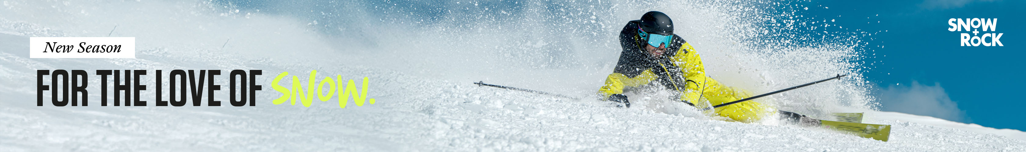 Shop Snow + Rock new season. A man in yellow ski gear skiing down the mountain